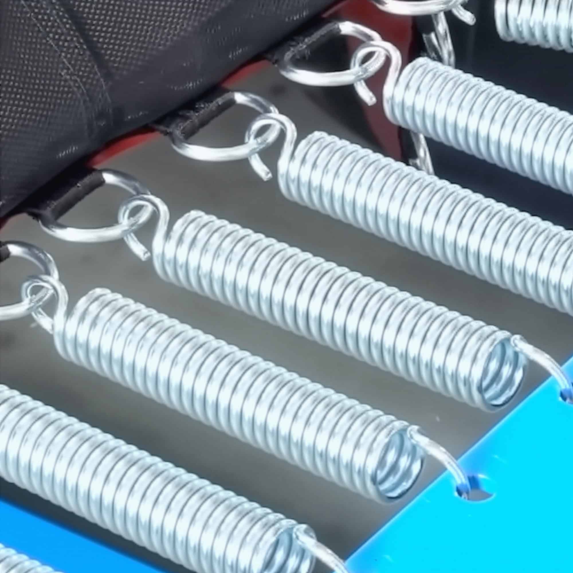 A photo with a close-up view of the springs on a Tumbl Trak.
